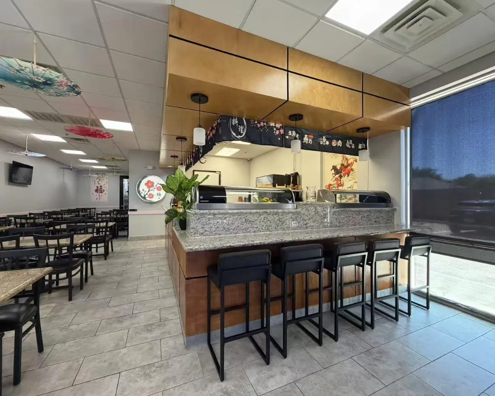 Granite sushi bar with high stools beside large window at Mei Garden Asian Cuisine, a Asian Restaurant in Sugar Land